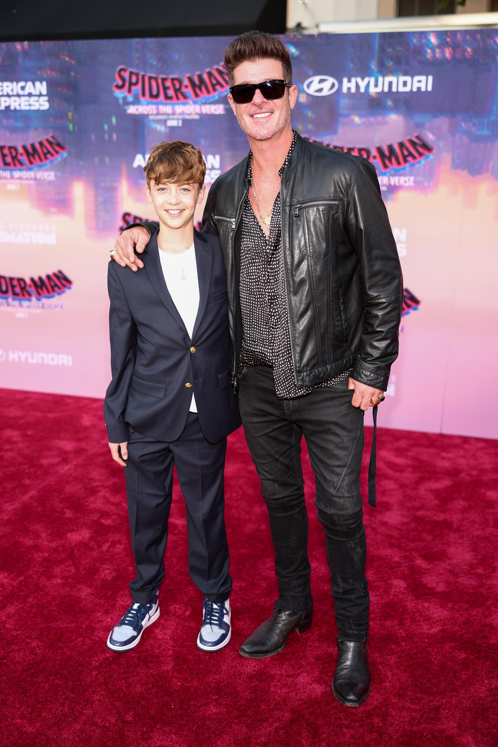 Julian Fuego and Robin Thicke are seen at the World Premiere of Sony Pictures Animation's "Spider-Man: Across the Spider Verse," at Regency Village Theatre on May 30, 2023, in Los Angeles, California | Source: Getty Images