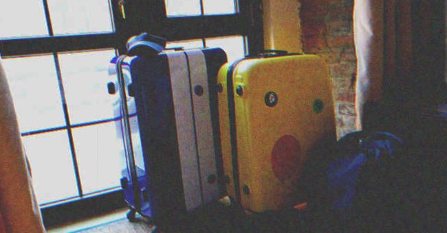 Suitcases lined up by the front door | Source: Shutterstock