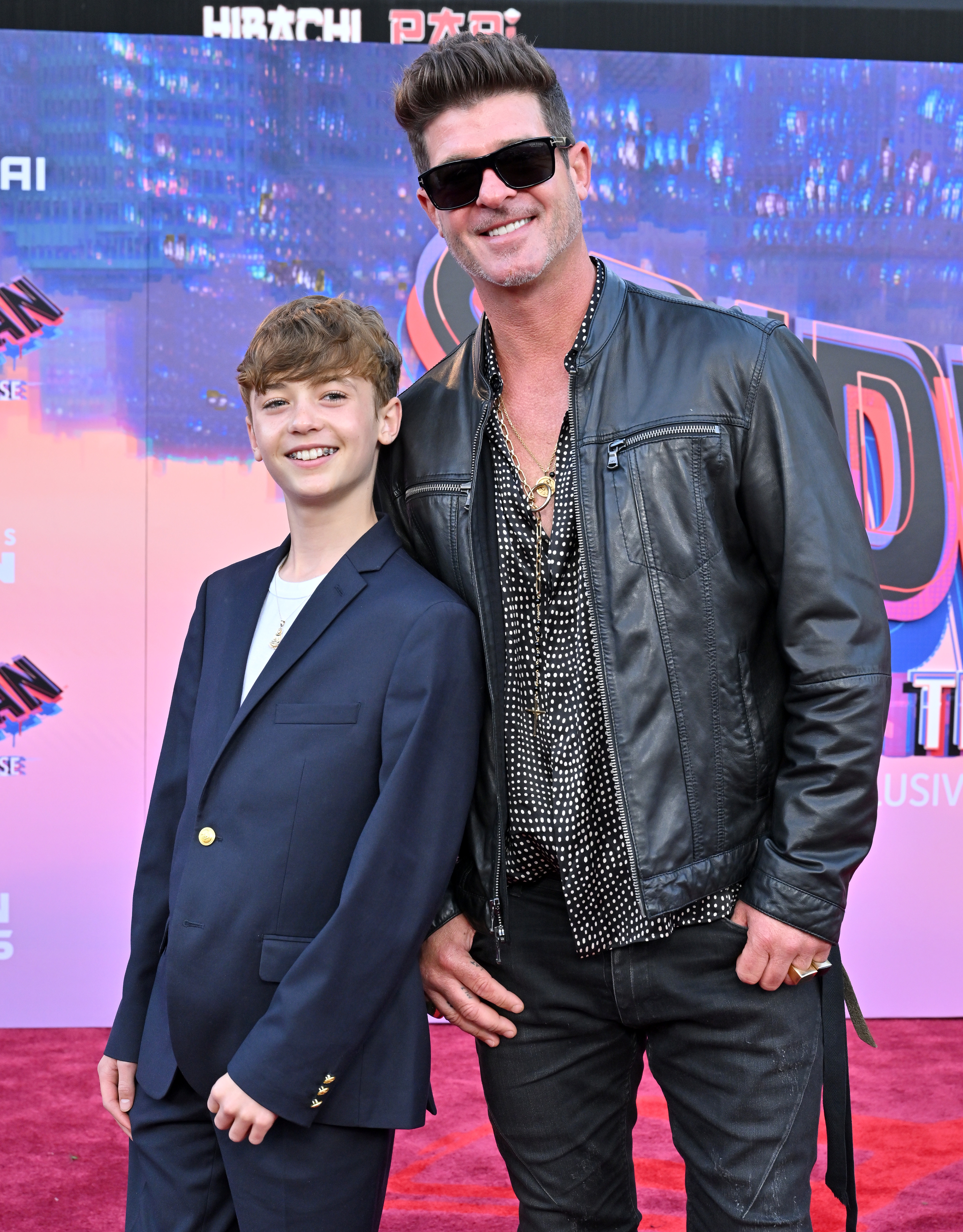 Julian Fuego and Robin Thicke attend the World Premiere of Sony Pictures Animation's "Spider-Man: Across the Spider Verse," at Regency Village Theatre on May 30, 2023, in Los Angeles, California | Source: Getty Images