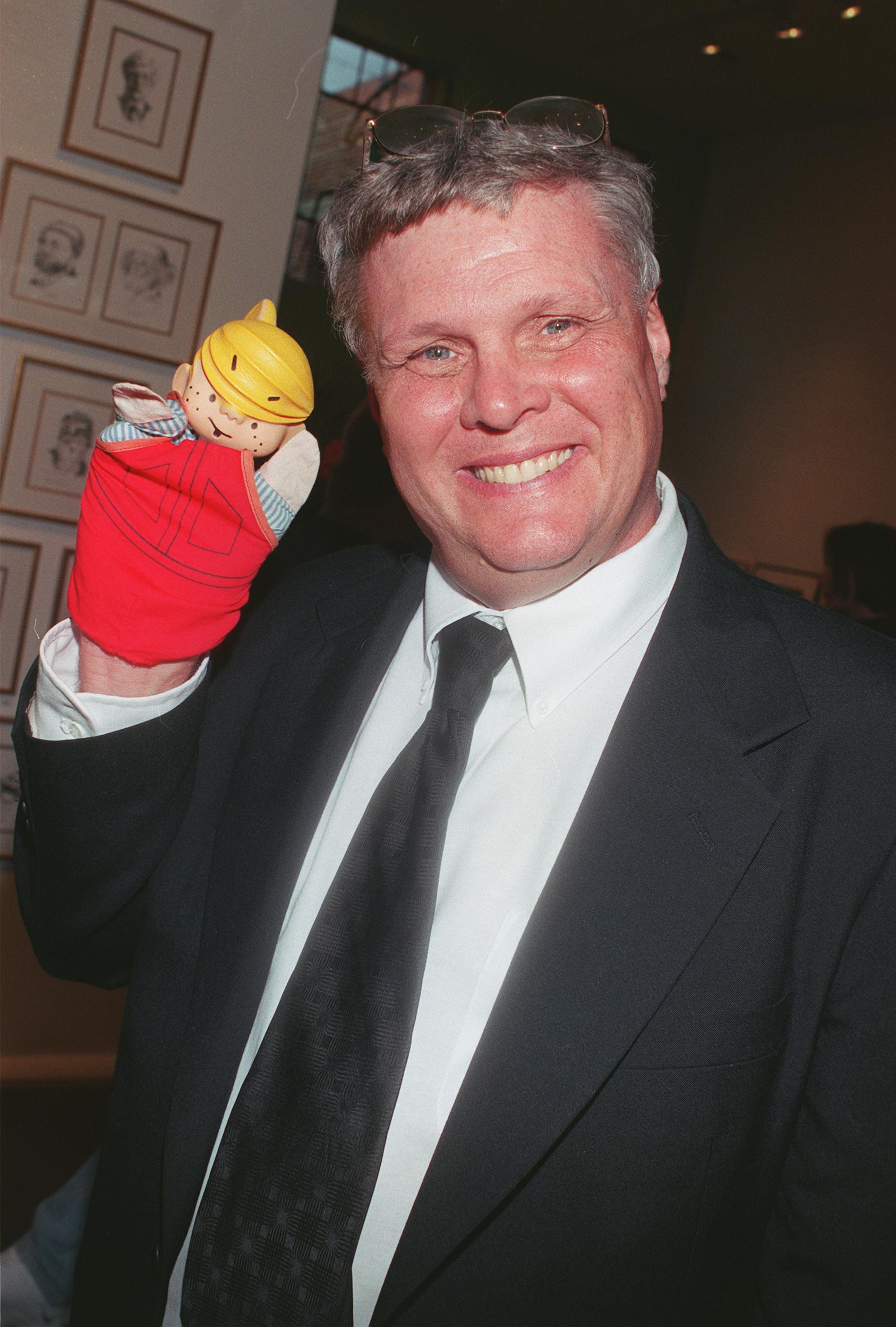 "Dennis The Menace" TV star Jay North holding a Dennis puppet during the celebration of the 50th anniversary of the cartoon strip at the "Every Picture Tells A Story" art gallery, circa 1999, in Los Angeles, California | Source: Getty Images