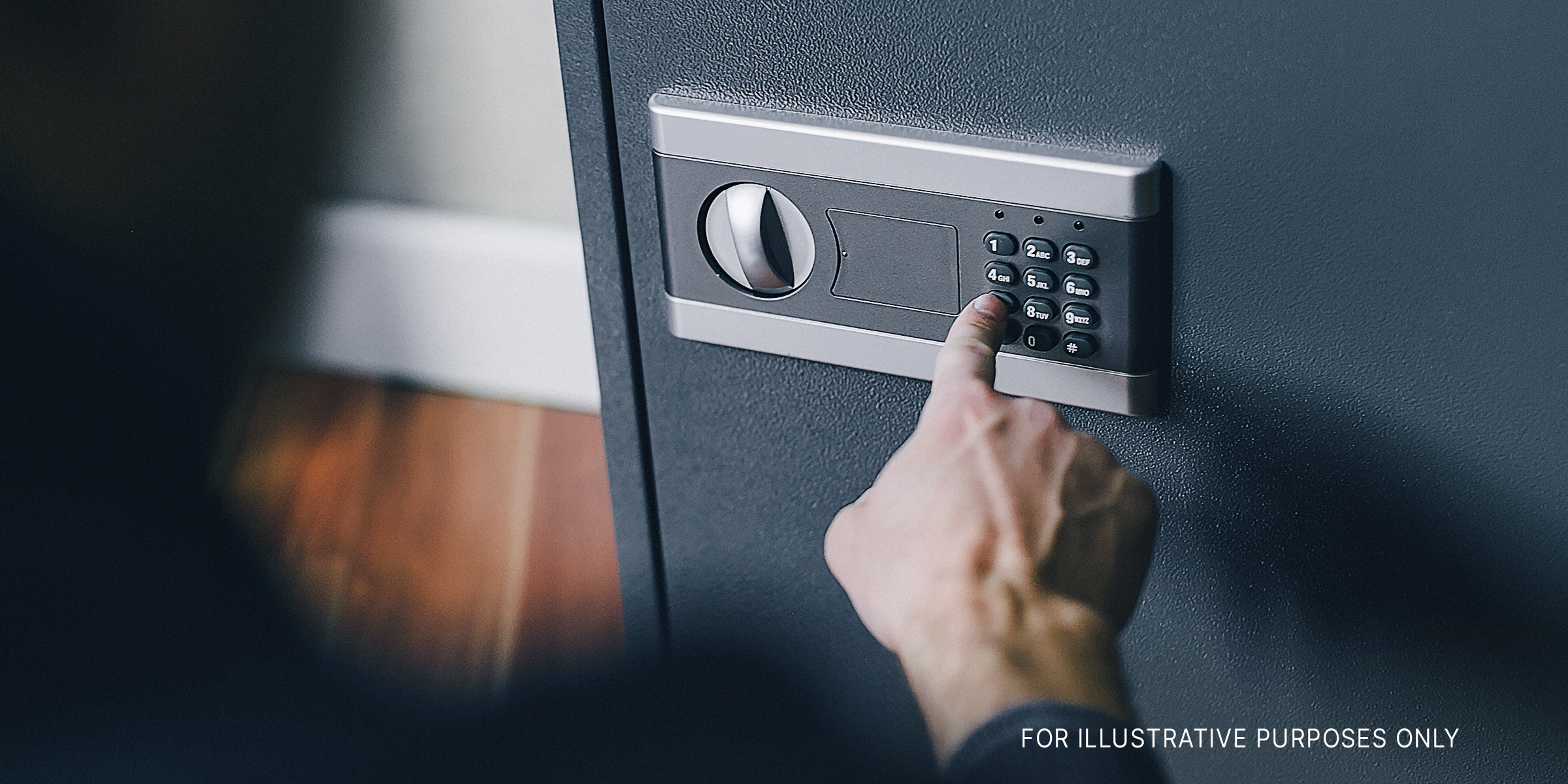 A person using the keypad on a safe | Source: Shutterstock