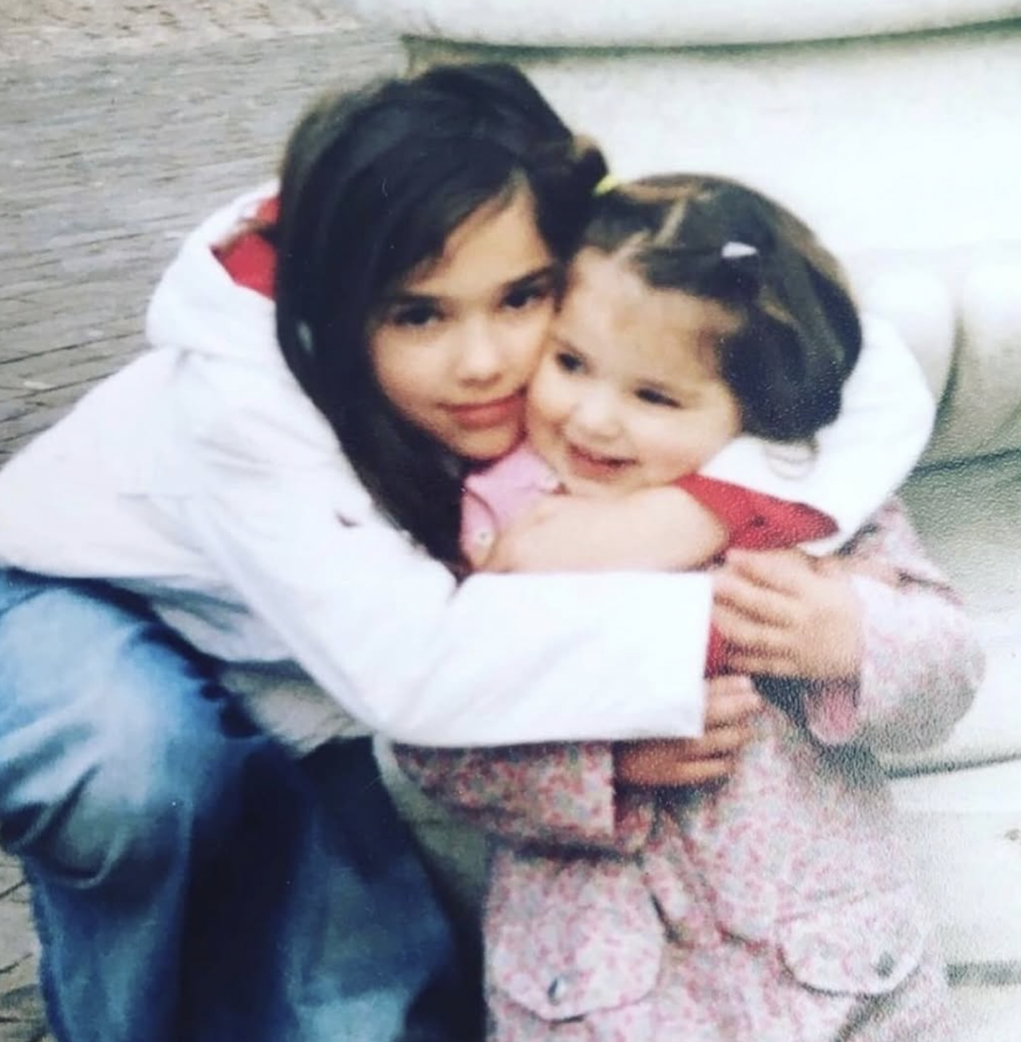 The musical star and her younger sister as children from a post dated May 14, 2025. | Source: Facebook/Dua Lipa