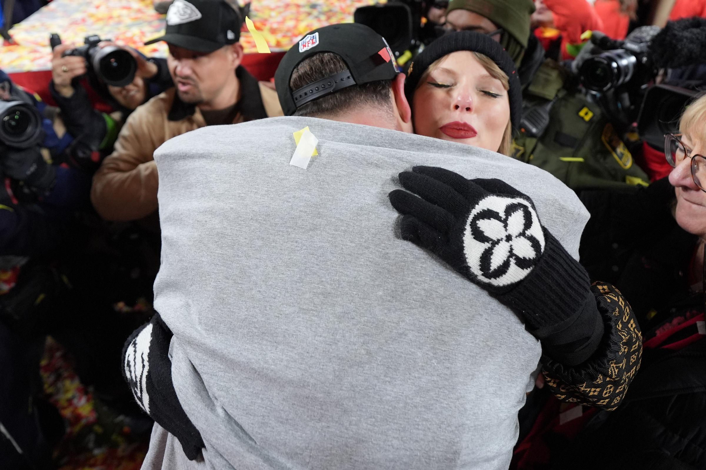 Travis Kelce and Taylor Swift share a hug at GEHA Field at Arrowhead Stadium in Kansas City, Missouri, on January 26, 2025 | Source: Getty Images