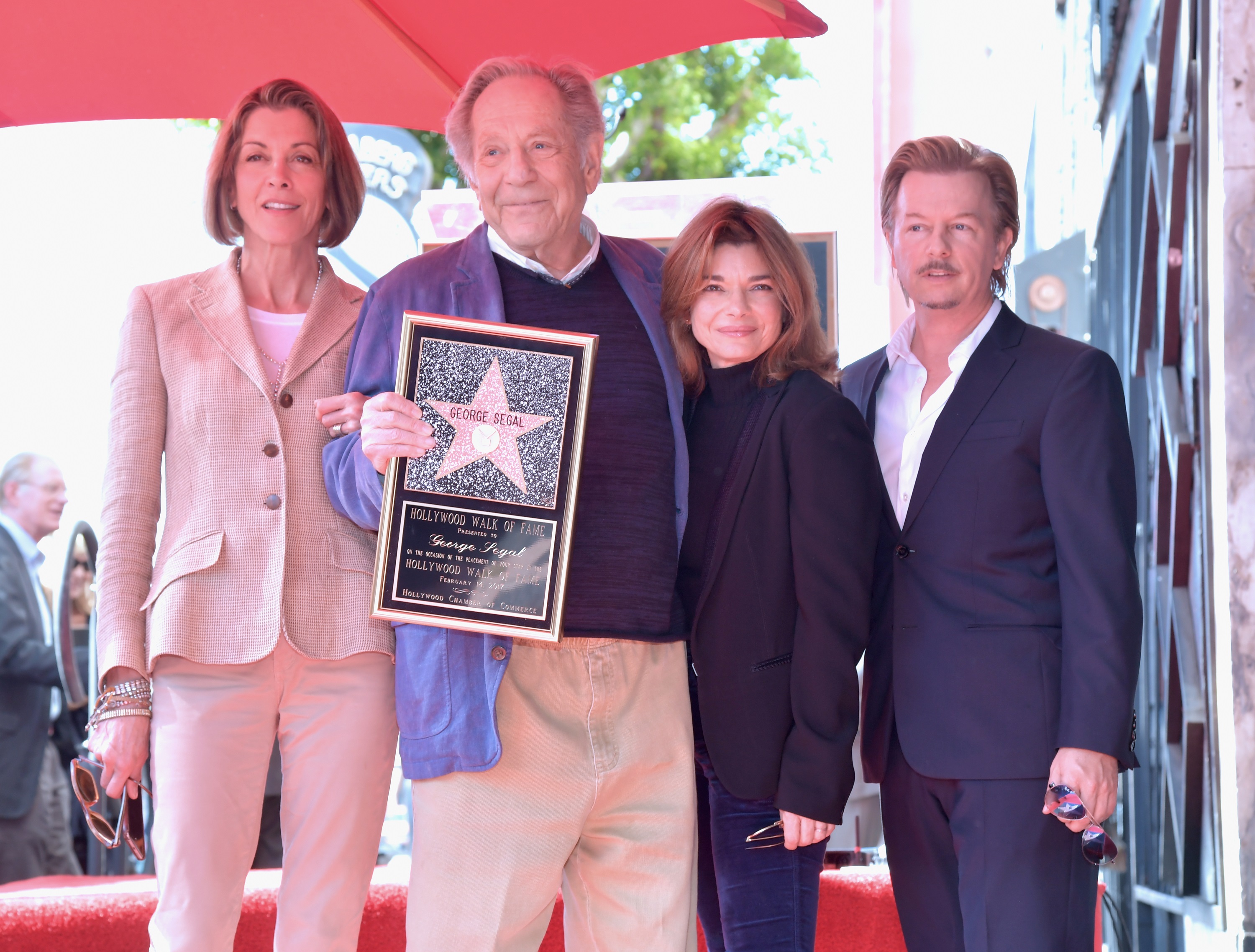 Wendie Malick, George Segal, Laura San Giacomo, and David Spade attend George Segal's star ceremony on the Hollywood Walk of Fame on February 14, 2017, in Los Angeles, California | Source: Getty Images