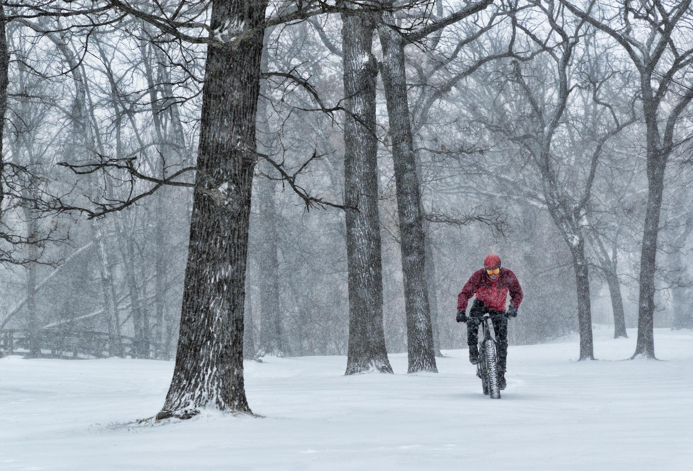A biker riding in a snowstorm in Minnesota, dated August 4, 2018 | Source: Getty Images