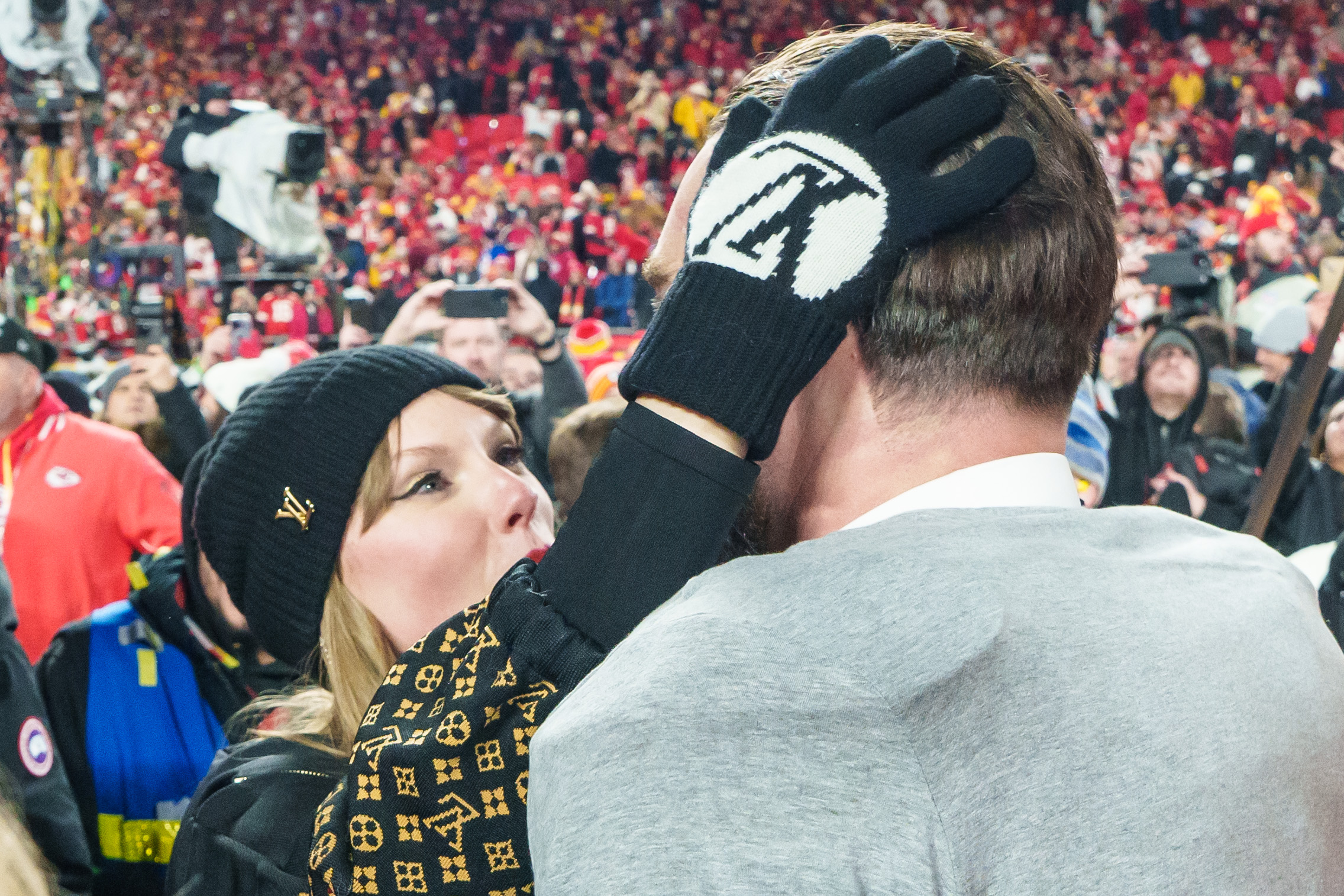 Taylor Swift embraces Travis Kelce following the AFC Championship NFL football game against the Buffalo Bills at GEHA Field at Arrowhead Stadium in Kansas City, Missouri, on January 26, 2025 | Source: Getty Images
