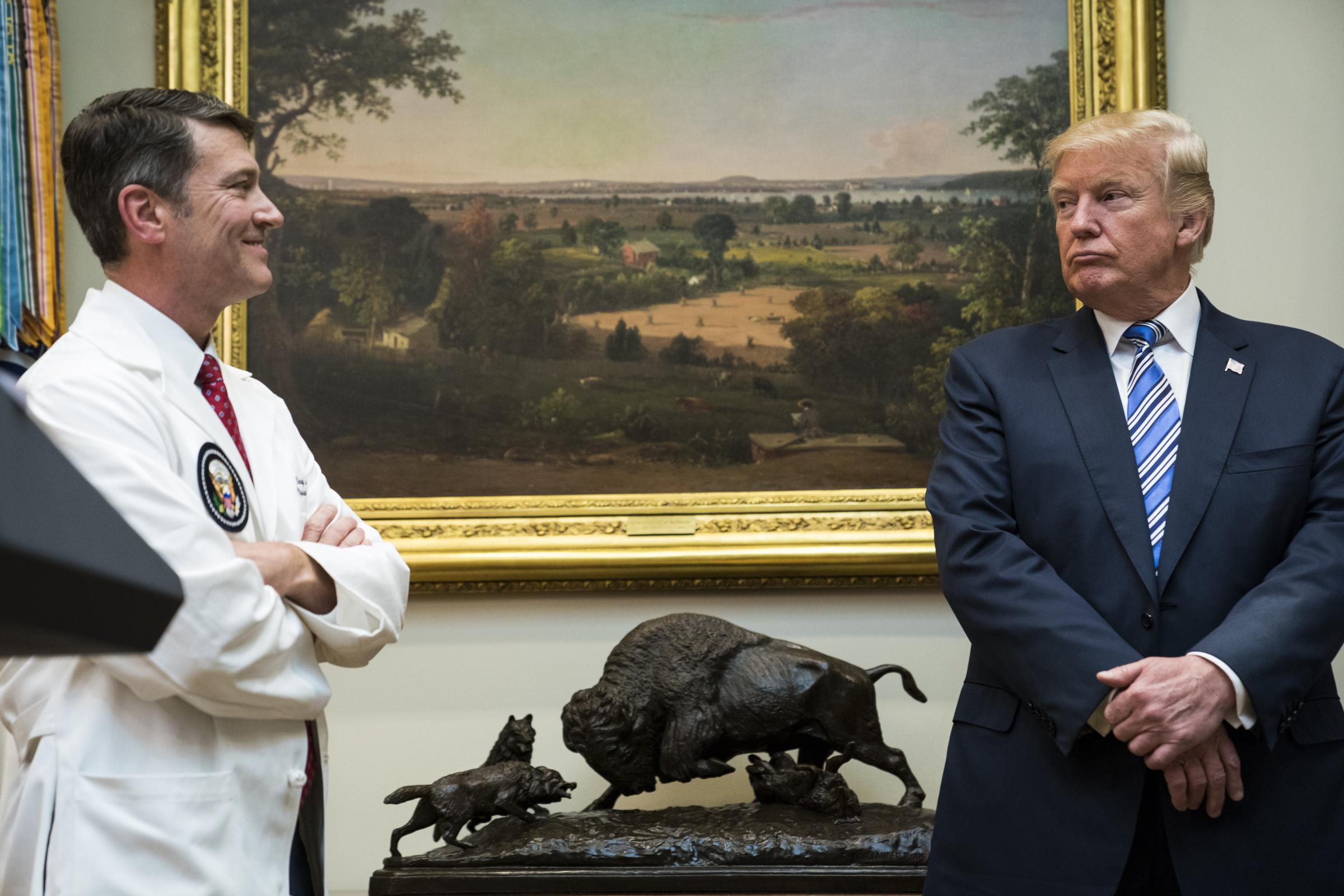 Donald Trump and Dr. Ronny Jackson during a Veterans Affairs Department "telehealth" event in the Roosevelt Room of the White House on August 3, 2017 | Source: Getty Images