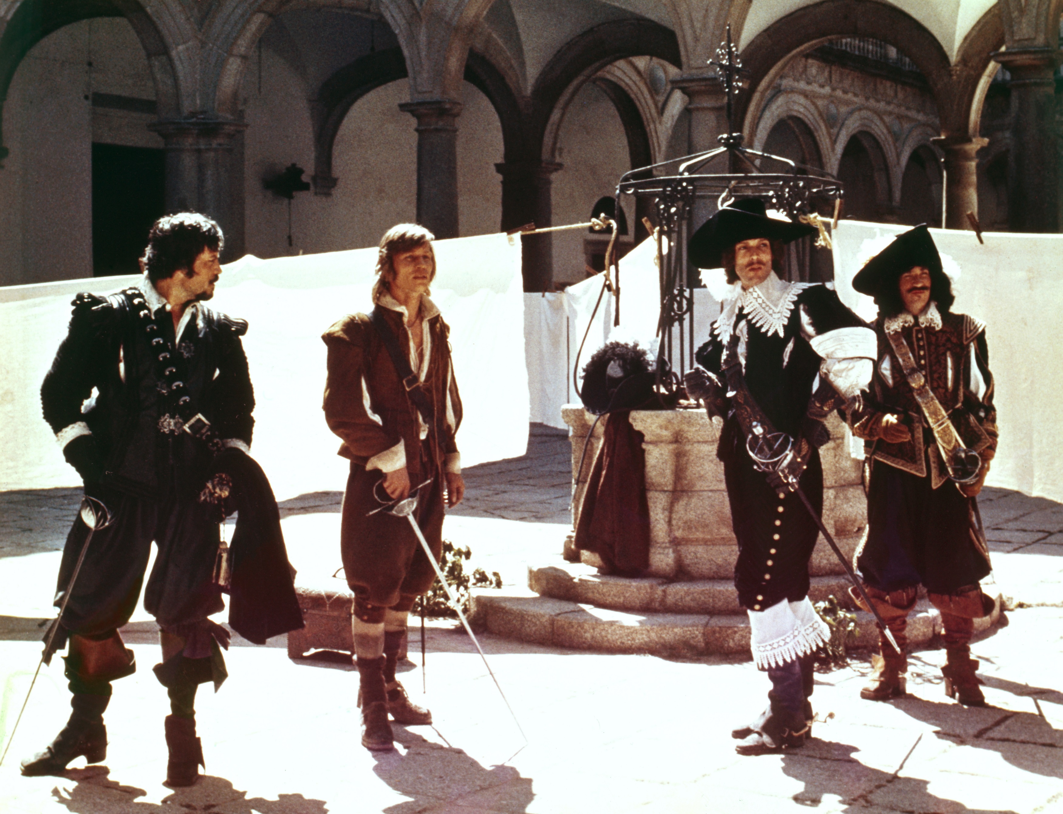 Oliver Reed, Michael York, Richard Chamberlain, and Frank Finlay on the set of "The Three Musketeers" on January 1, 1973 | Source: Getty Images