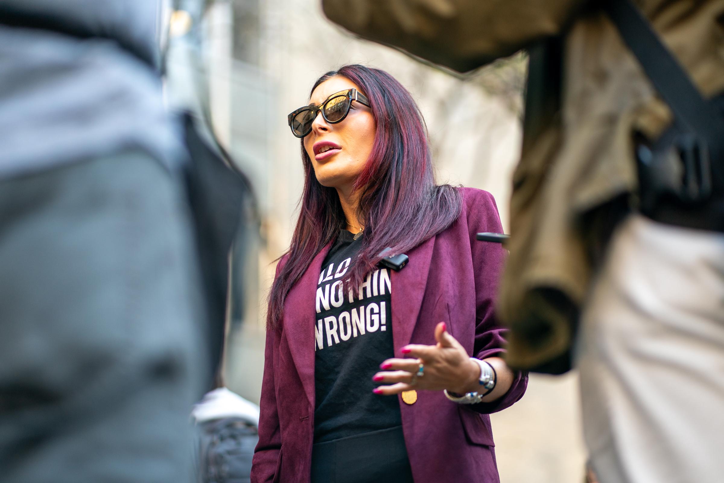 Laura Loomer speaks to the media prior to the beginning of former President Donald Trump's Trial at Manhattan Criminal Court on April 15, 2024 | Source: Getty Images