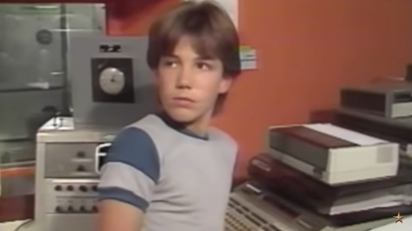 A photo of a young boy listening attentively | Source: YouTube/TheGrahamNortonShow