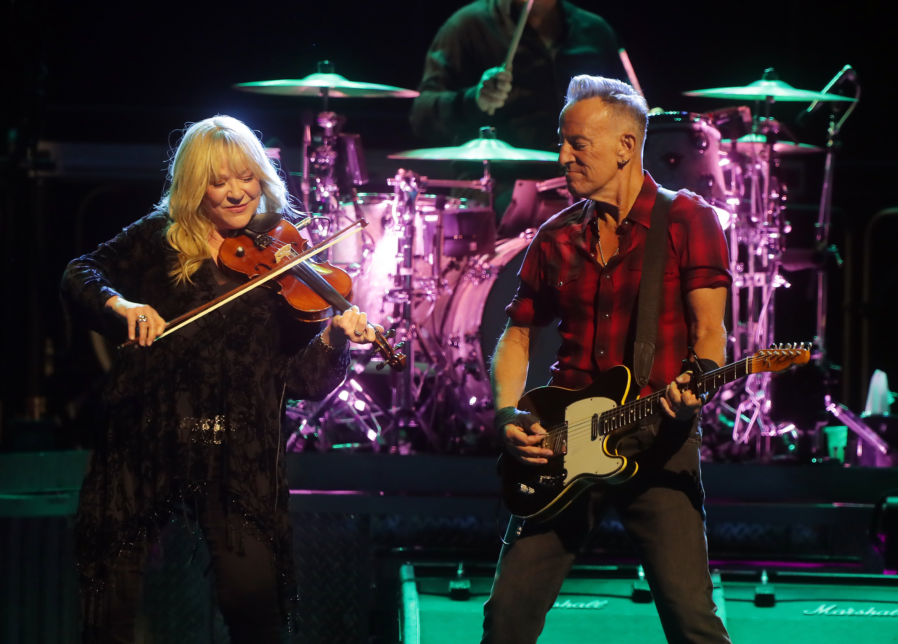 Soozie Tyrell and Bruce Springsteen performing at Footprint Center on March 19, 2024 in Phoenix, Arizona. | Source: Getty Images
