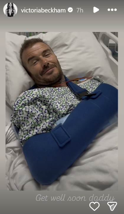 David Beckham pictured in a hospital bed, wearing a gown and blue arm sling, from an Instagram story dated June 27, 2025 | Source: Instagram/victoriabeckham