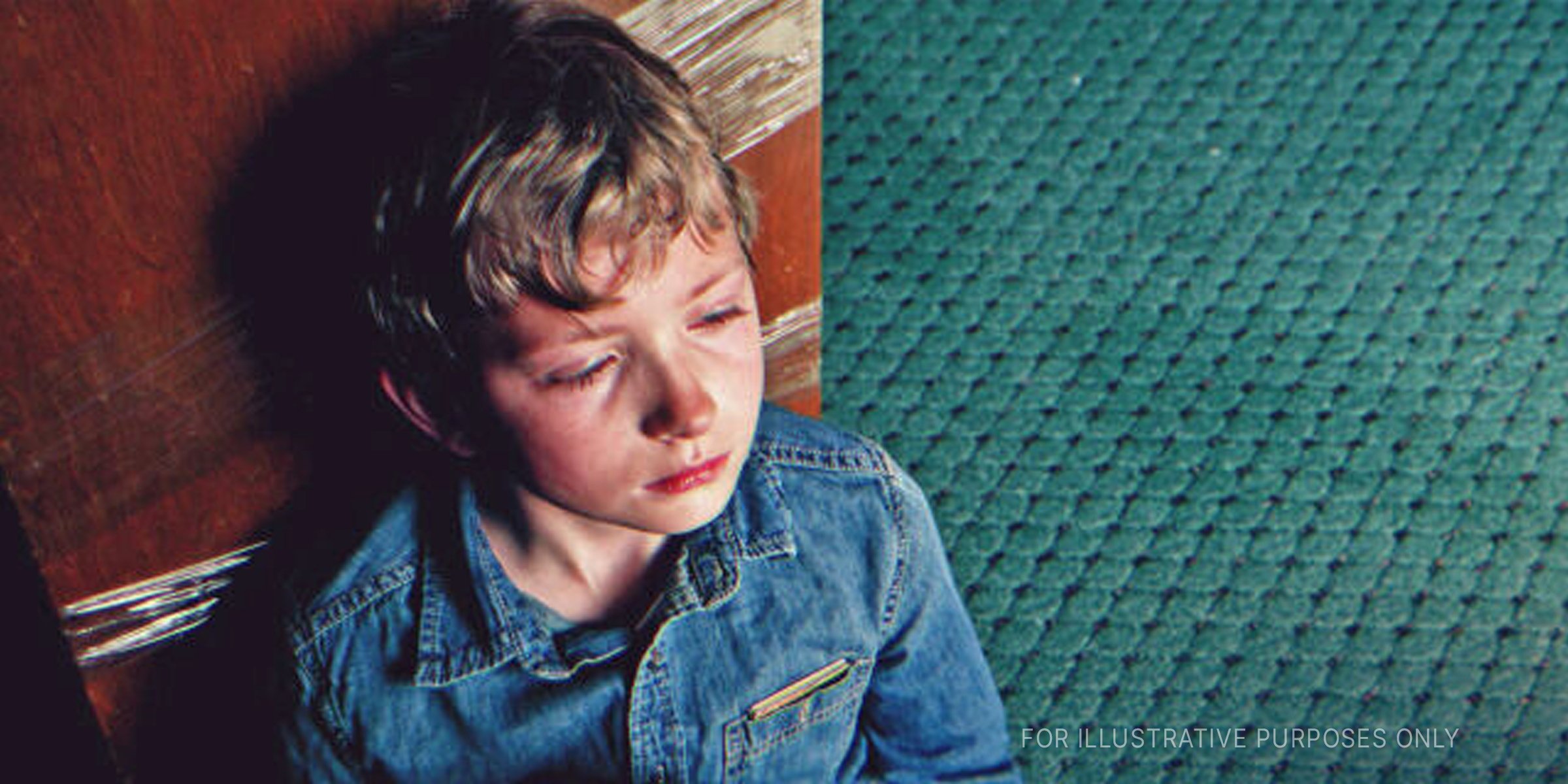Sad boy sitting on sand | Source: Shutterstock