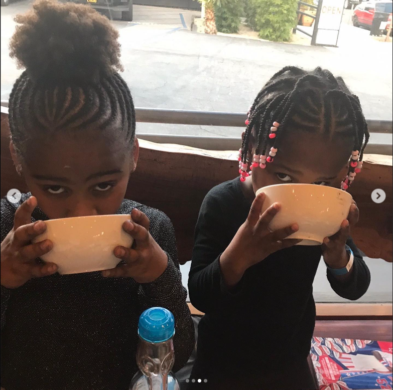 Jackson and August Theron drinking from their plates | Source: Instagram/charlizeafrica