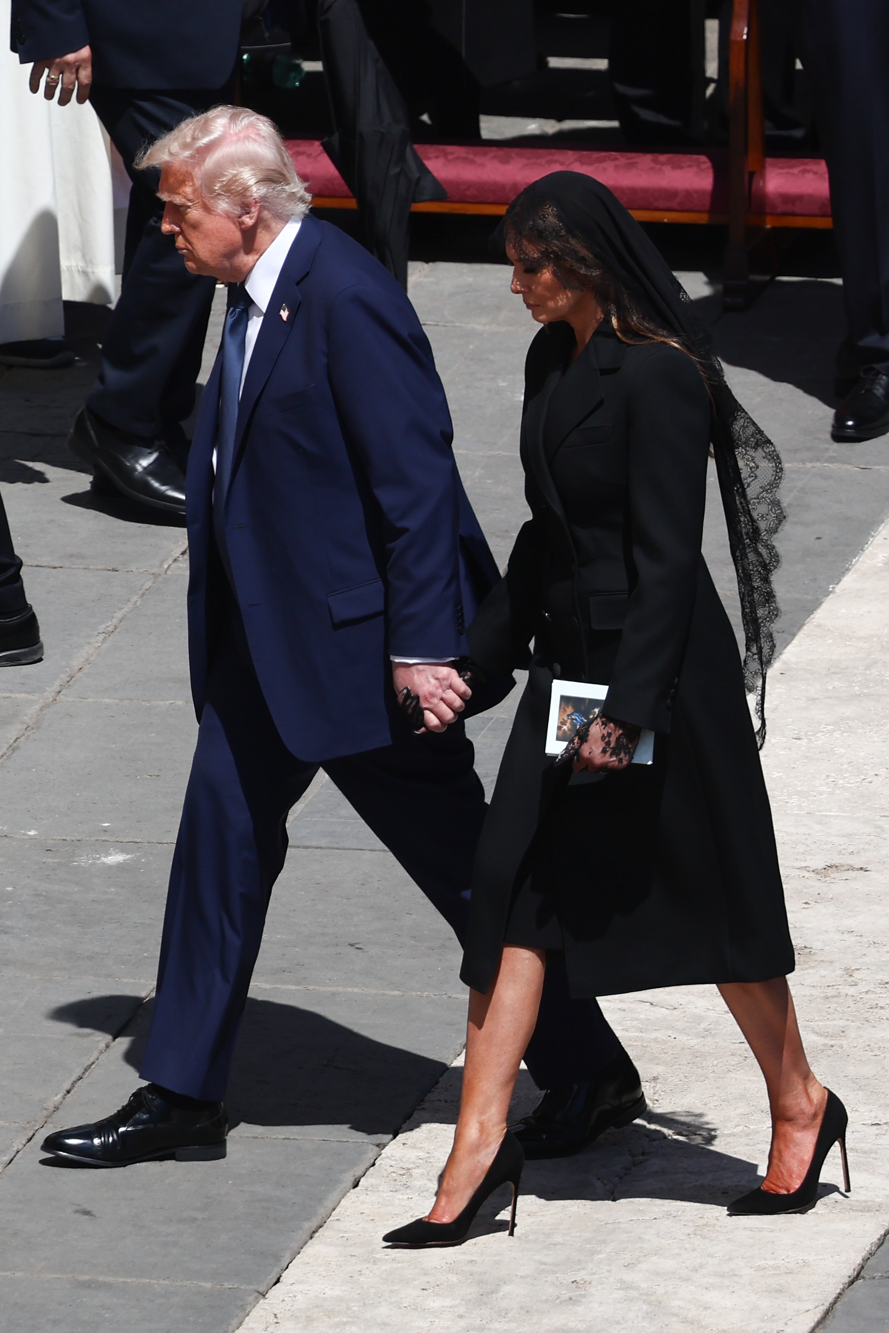 Donald and Melania Trump during the funeral ceremony of Pope Francis at Saint Peter's Square in Vatican, Rome, on April 26, 2025 | Source: Getty Images