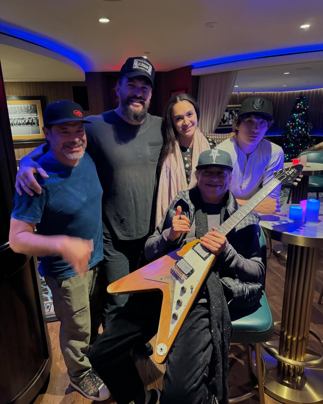 Jason Momoa, Lola, and Nakoa-Wolf posing with band members from a post dated December 14, 2024 | Source: Instagram/prideofgypsies