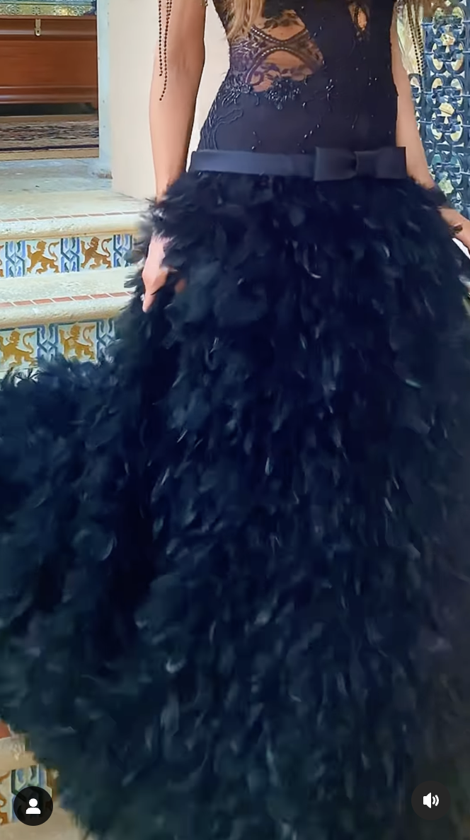 A closeup shot of Kimberly Guilfoyle's black dress from the Wags to Riches Gala, as seen in a video dated March 24, 2025 | Source: Instagram/realoscarlopez