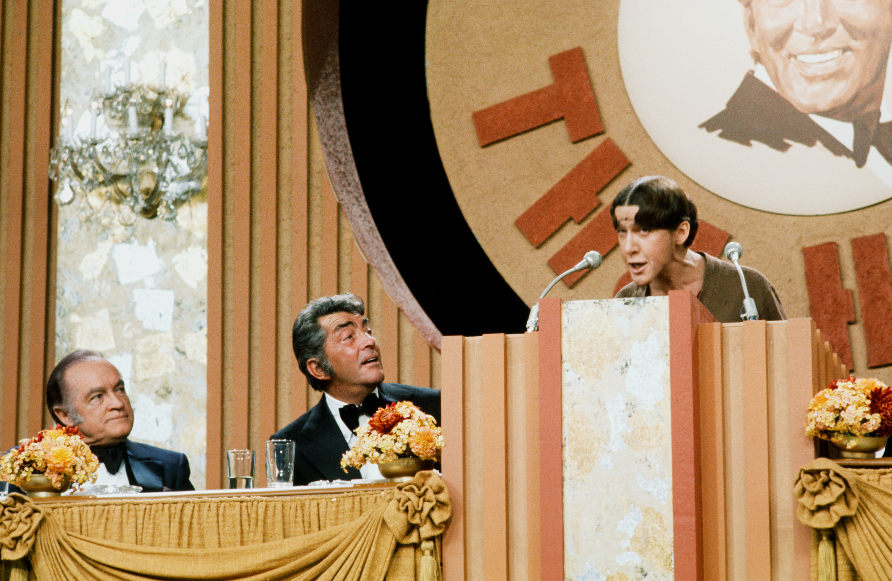 Bob Hope, Dean Martin, and Ruth Buzzi as Gladys Ormphby during an episode of "Celebrity Roast of Dean Martin" in 1976 | Source: Getty Images