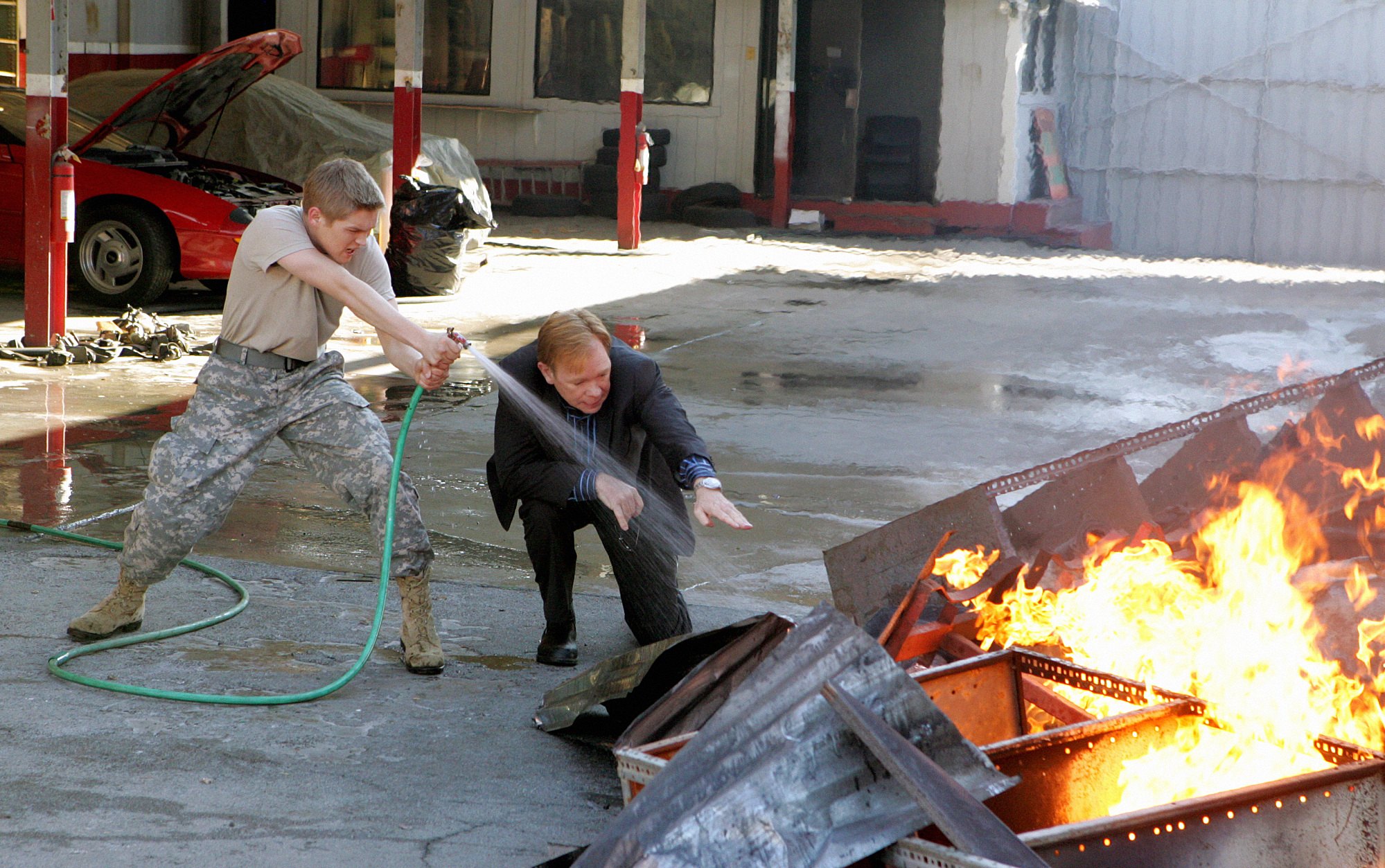 Evan Ellingson and David Caruso on the set of "CSI: Miami" on February 11, 2010. | Source: Getty Images
