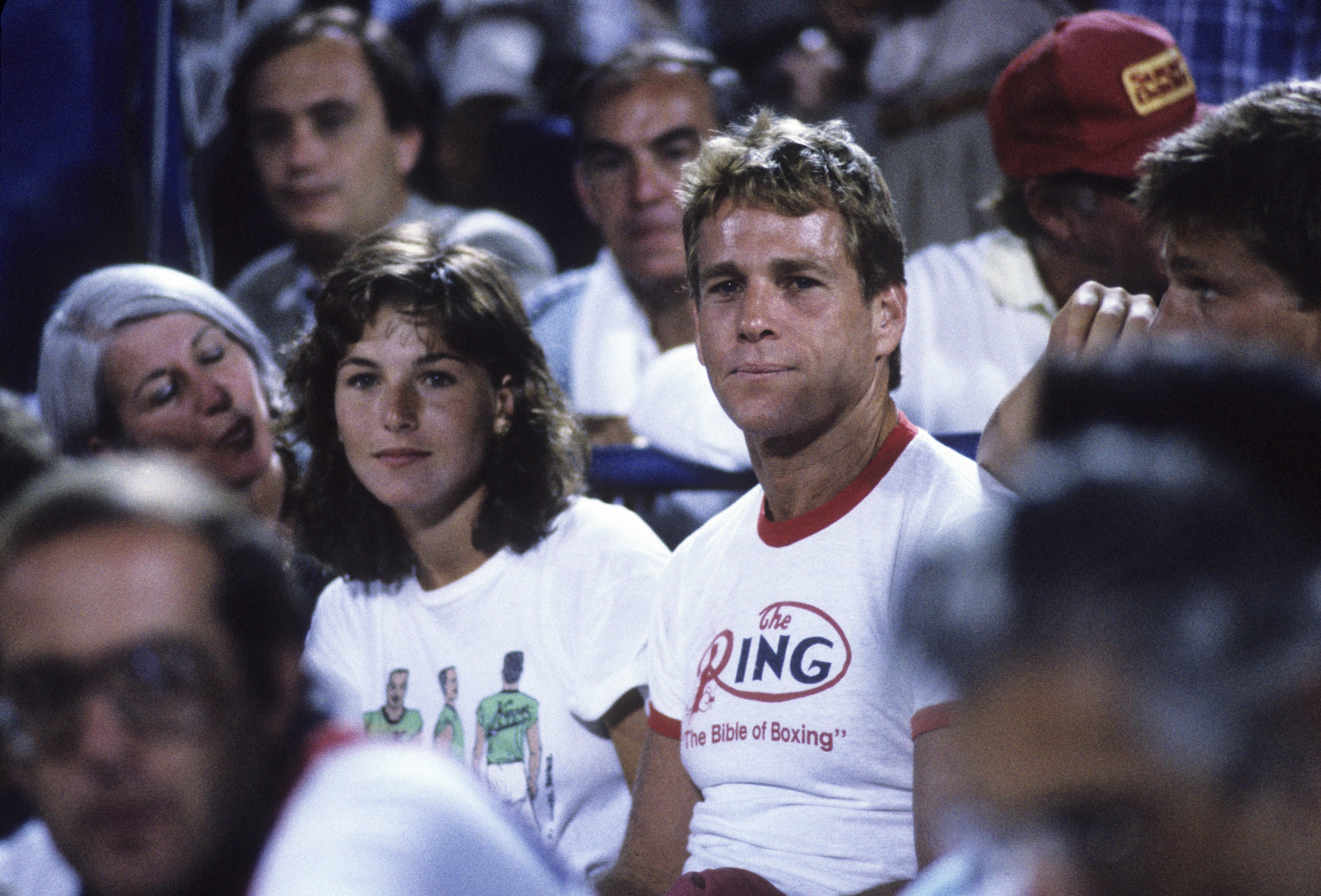 The screen star and John McEnroe at the National Tennis Center in Flushing, New York, in 1985. | Source: Getty Images