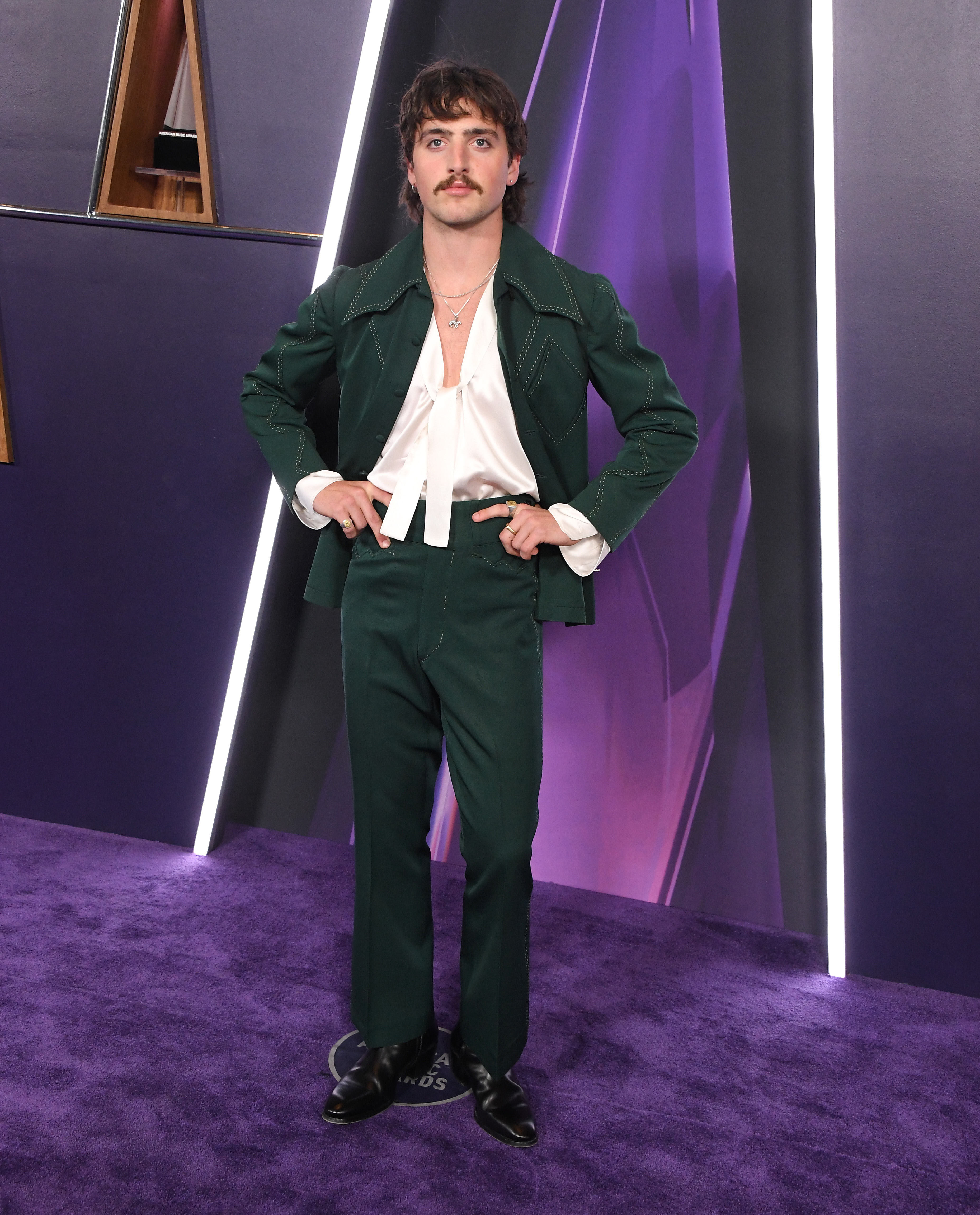Benson Boone brought subtle edge to the 2025 AMAs with silver chains and a playful pendant, perfectly highlighting the wide lapels and bold contrast stitching of his sharp, statement-making jacket.