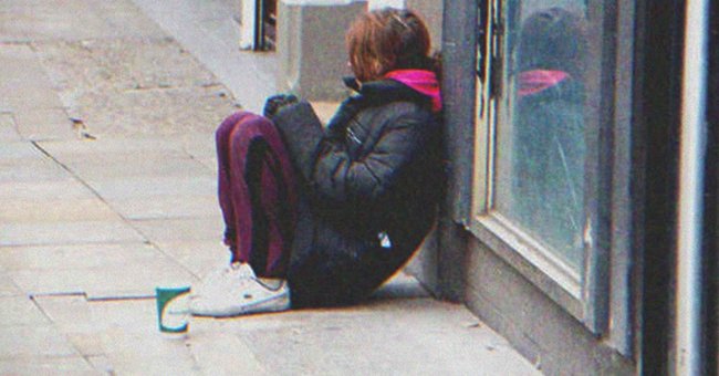 A young girl sitting on the street | Source: Shutterstock